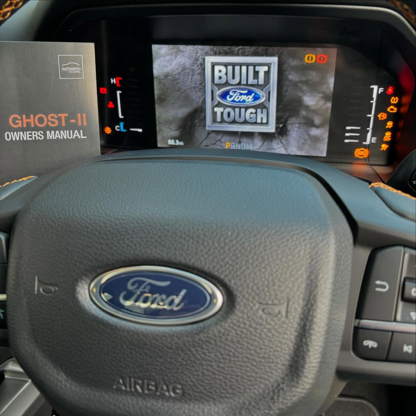 Steering and dash of a Ford Ranger with a Ghost Immobiliser handbook